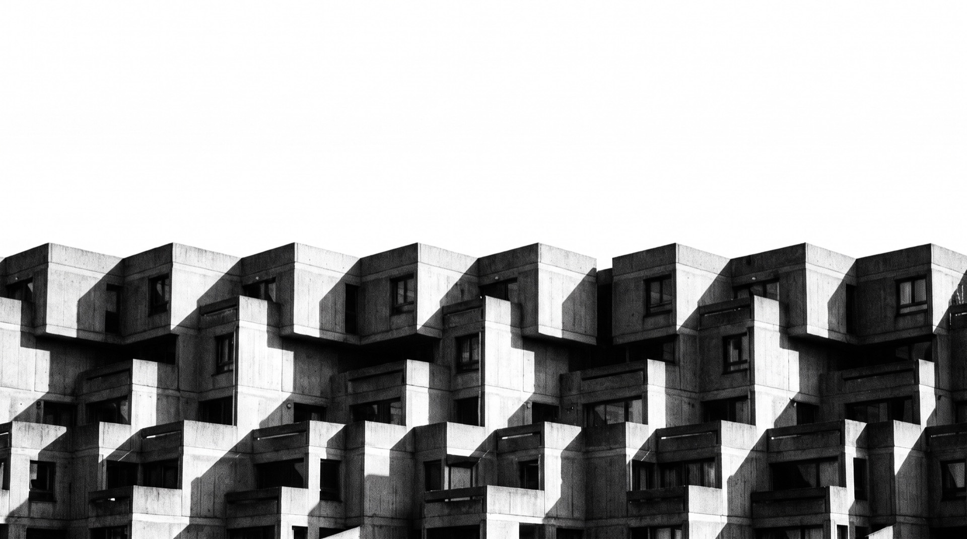 Modular stacked brutalist housing complex, repeating concrete volumes, black and white.